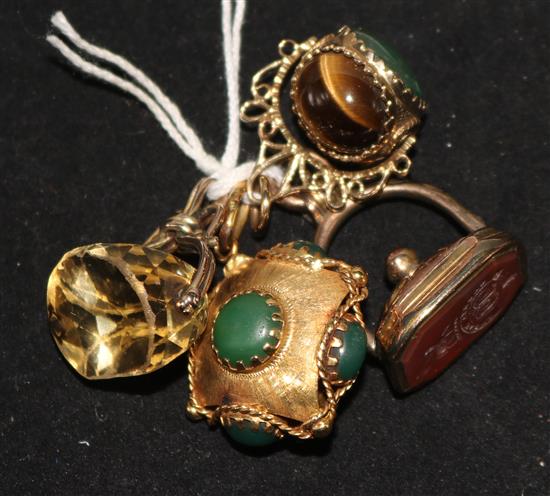 An Italian 18ct gold and green cabochon set pendant and three gem set fob seals.